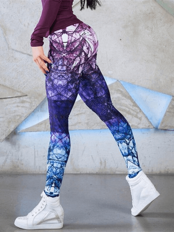 Woman wearing vibrant high-waisted elastic leggings, sportswear for fitness, ankle-length with a stylish pattern, paired with white sneakers.