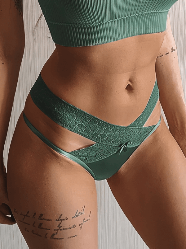 Stylish green lace thong with cutouts offers breathable comfort and a low-rise fit for women, perfect for fashionable everyday wear.