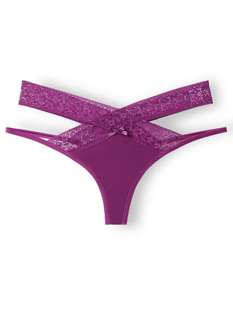 Purple lacy thong with cutouts offering a sexy, breathable fit for women. Features low-waist, durable polyester blend for all-day comfort.