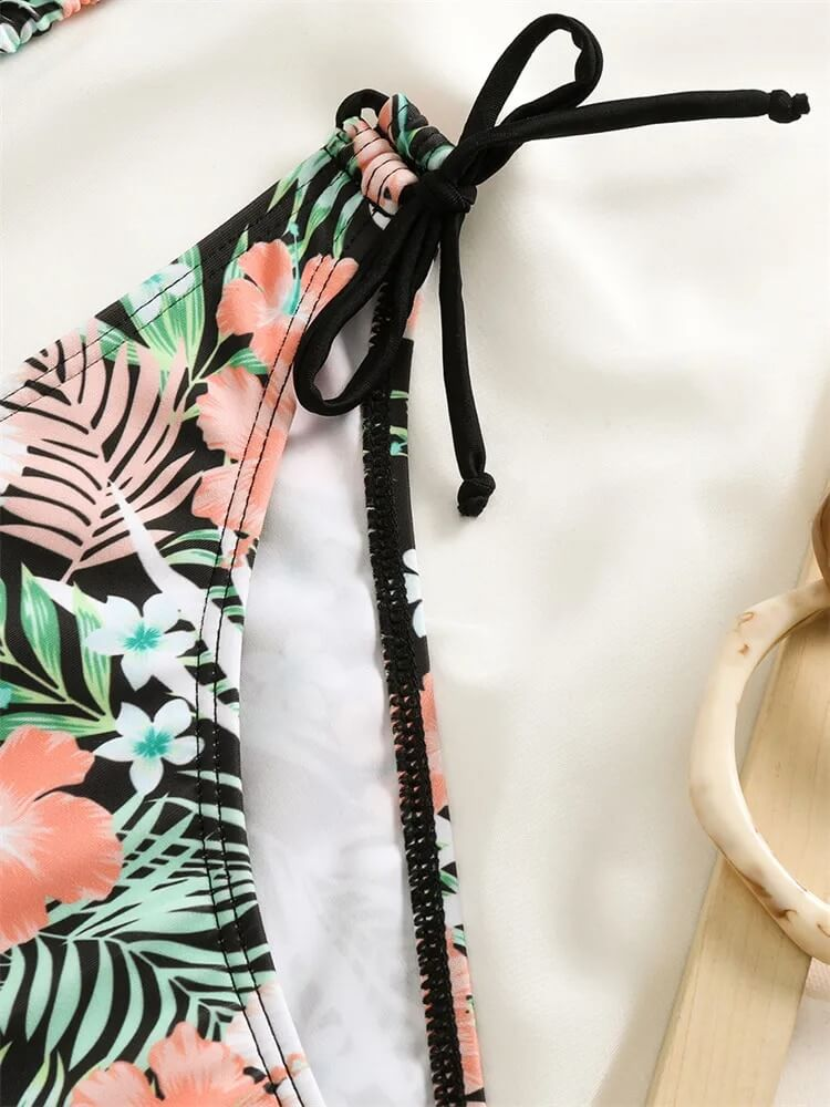 Close-up of floral print women's bikini top with adjustable tie, perfect for beach fashion and comfort.
