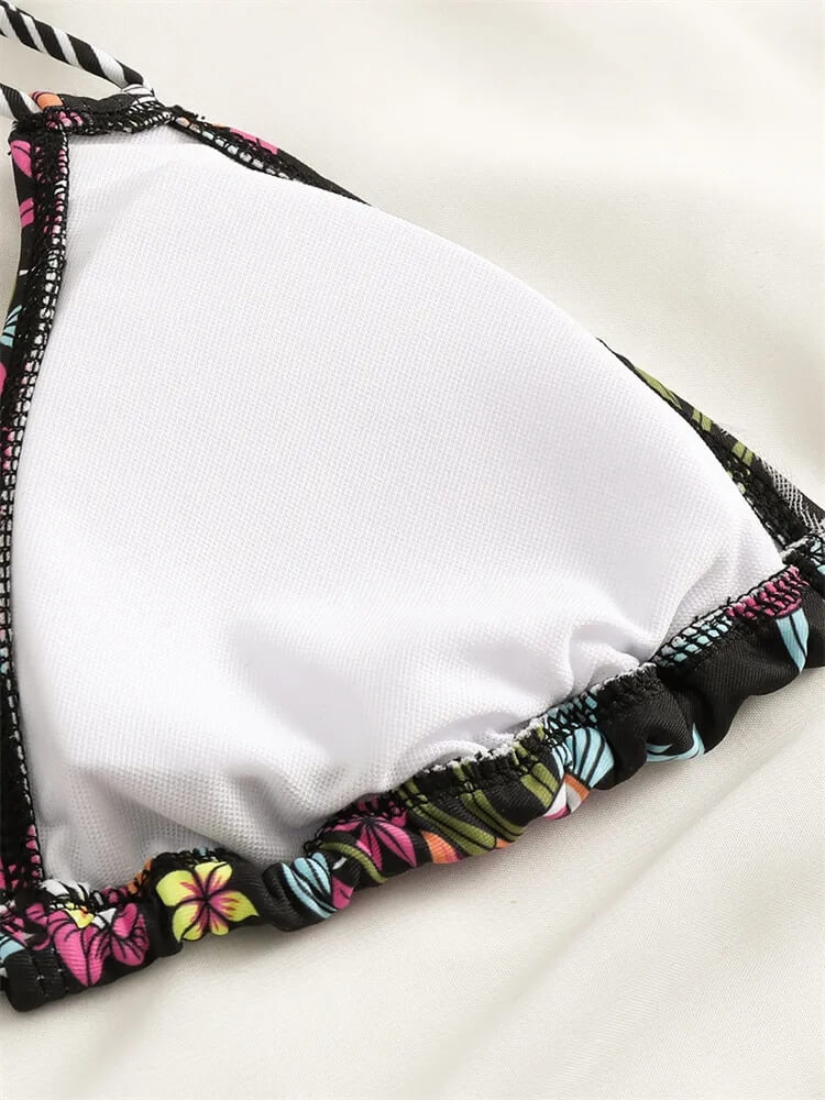 Colorful floral print bikini top with black trim, perfect for a stylish beach look, part of the Sexy Ladies Bikinis collection.