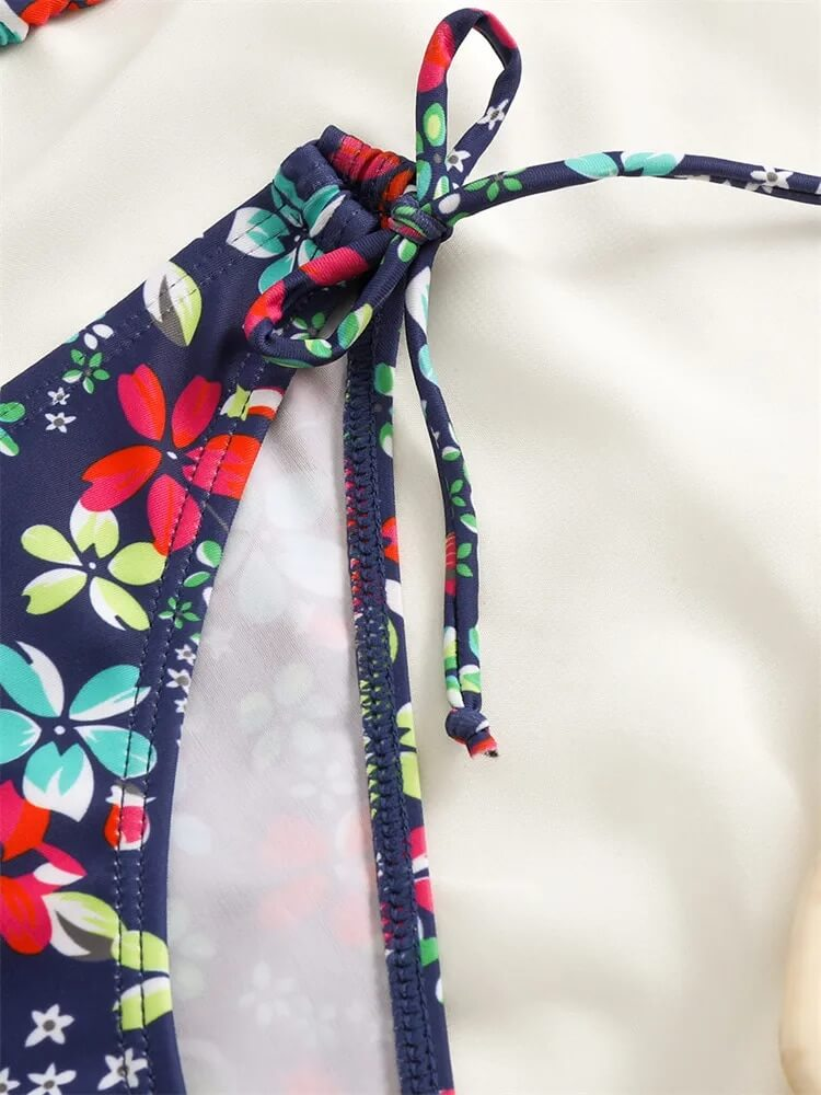 Colorful floral print bikini top with a tied strap detail for a trendy beach look.