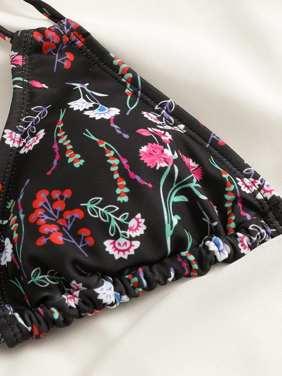 Black floral print bikini top for women, close-up on sexy two-piece swimsuit SF1086 design with colorful patterns.