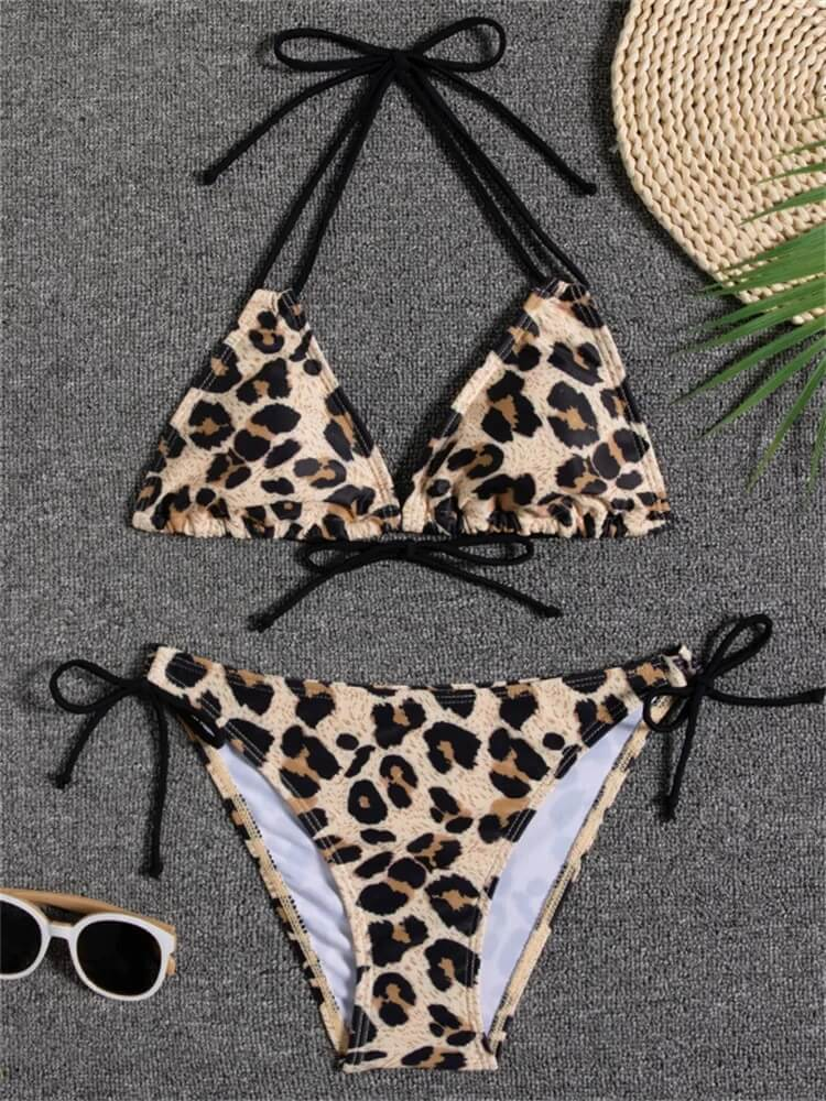 Leopard print bikini set with black ties, perfect for a stylish beach day. Features a trendy low waist design for comfort.
