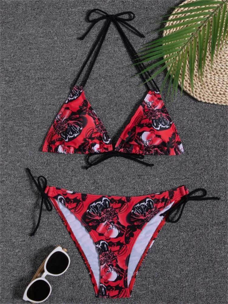 Red floral print two-piece bikini set with ties, featuring sunglasses and straw hat accents, perfect for stylish beach outings.