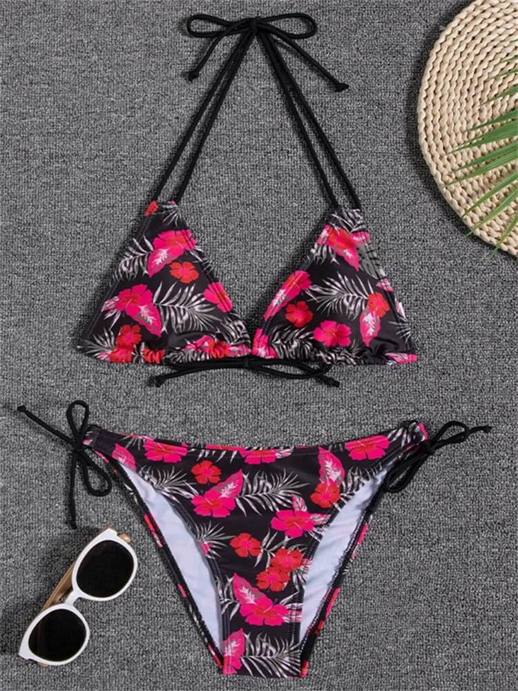Floral print bikini set with low waist design featuring vibrant pink flowers, perfect for a stylish beach day.