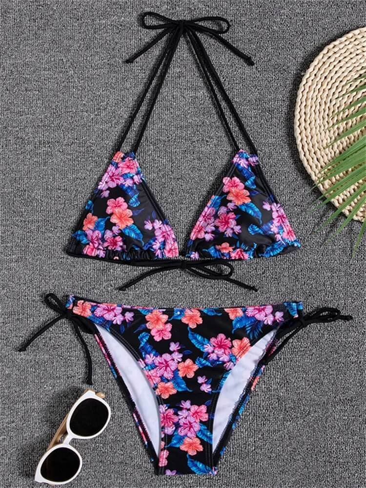 Floral print two-piece bikini swimsuit with sunglasses and straw hat