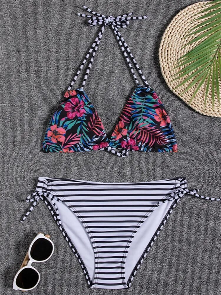 Floral print bikini top with striped bikini bottoms, low waist, perfect for beach days.