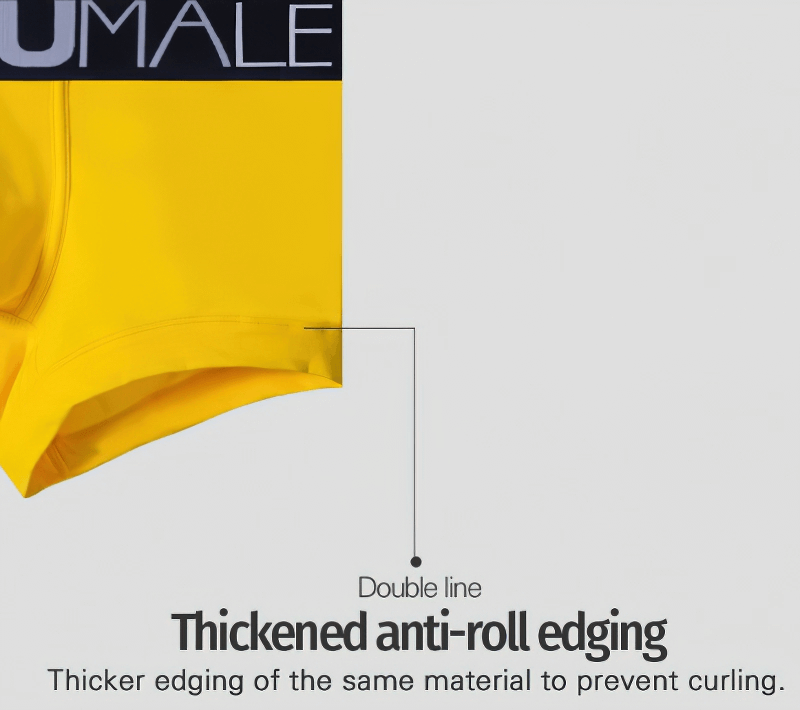 Close-up of yellow male underwear with thickened anti-roll edging detail and letter pattern waistband.