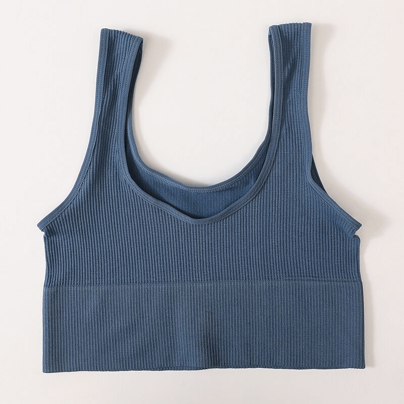 Blue ribbed seamless sports tank top for women, perfect for yoga and fitness, featuring a backless design and breathable fabric.