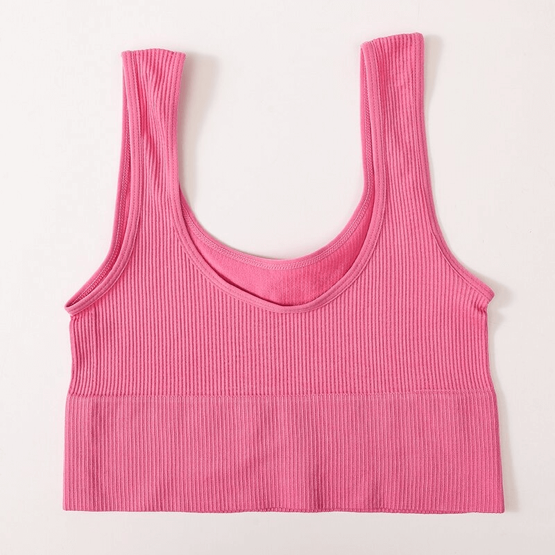 Pink ribbed seamless tank top for women, perfect for yoga and fitness, featuring a backless design for comfort and style.