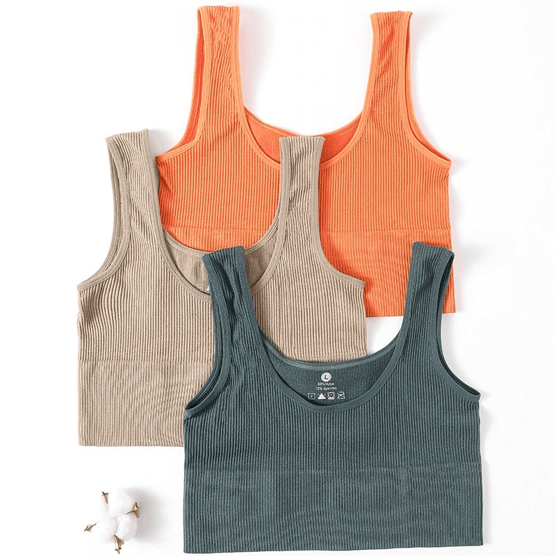 Three ribbed seamless tank tops in orange, beige, and teal, perfect for sports, yoga, and fitness, made of breathable nylon and spandex.