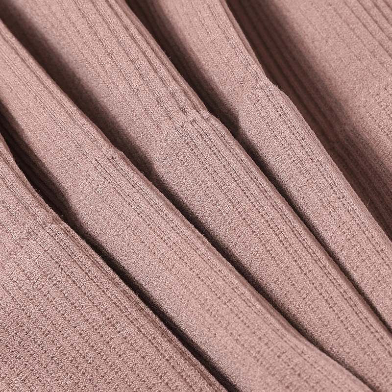 Close-up of ribbed fabric texture in soft pink, highlighting the breathable material of a seamless sports tank top for women.