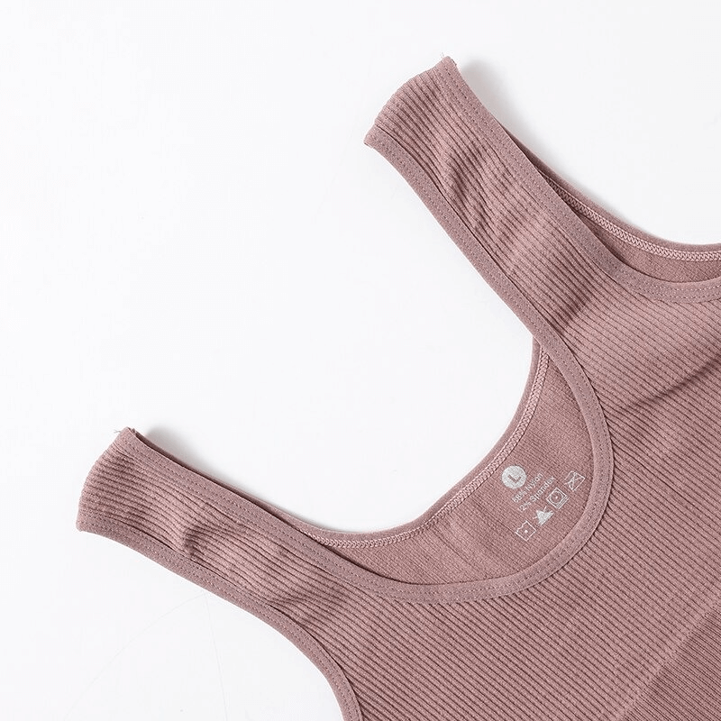Close-up of mauve ribbed seamless tank top for women, perfect for yoga and fitness. SF0030, breathable nylon spandex blend, slim fit.