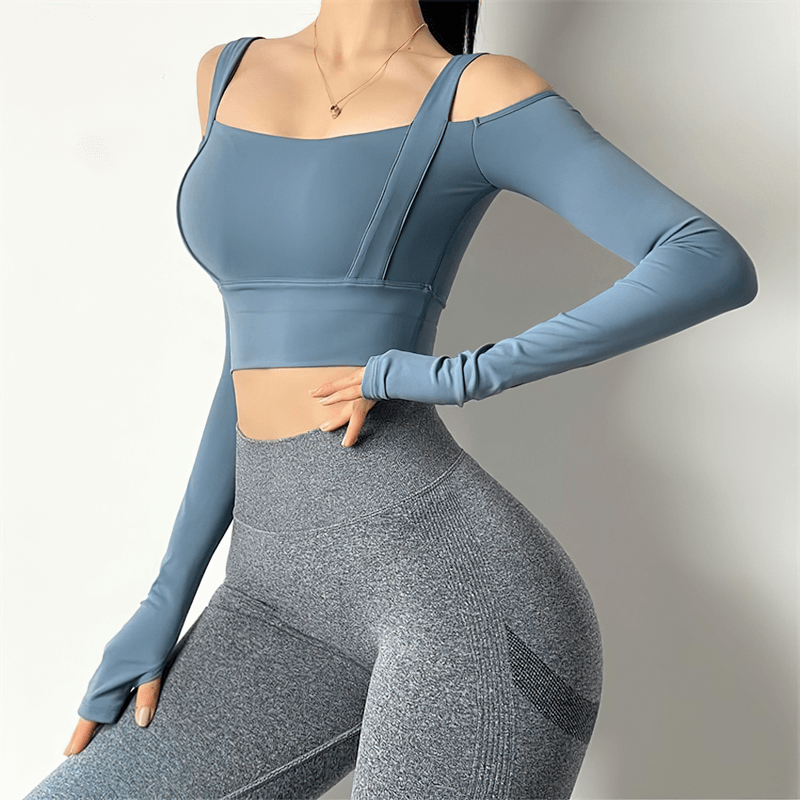 Stylish women's blue long-sleeve crop top with open shoulders, perfect for gym wear; flexible and breathable fabric for active comfort.