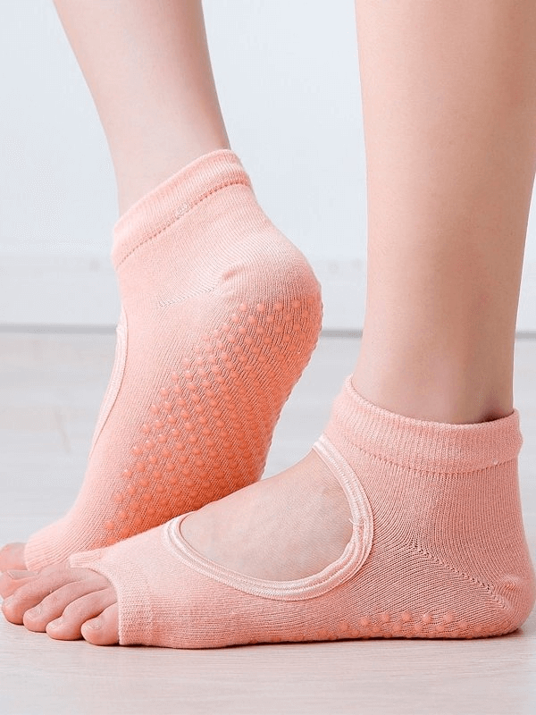 Peach open toe anti-slip women's socks for sports and yoga, featuring breathable fabric and moisture-wicking performance.