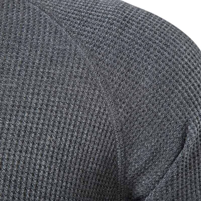 Close-up of a grey short-sleeved breathable t-shirt fabric texture for men's activewear fashion.