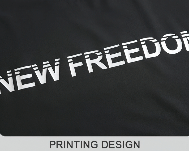 Close-up of 'NEW FREEDOM' print design on black sports t-shirt with quick-dry technology.