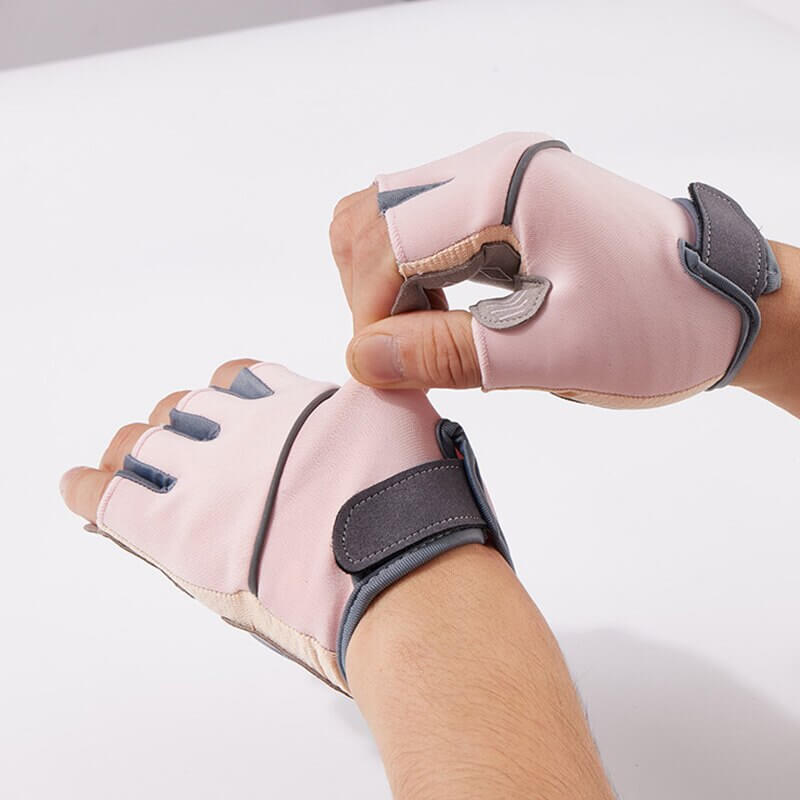 Unisex silicone anti-shock weight lifting gloves in pink with durable nylon and half-finger design for superior grip and comfort.