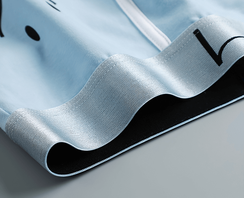 Close-up of light blue smiley print cotton boxer for men showcasing soft fabric and detailed design for ultimate comfort.