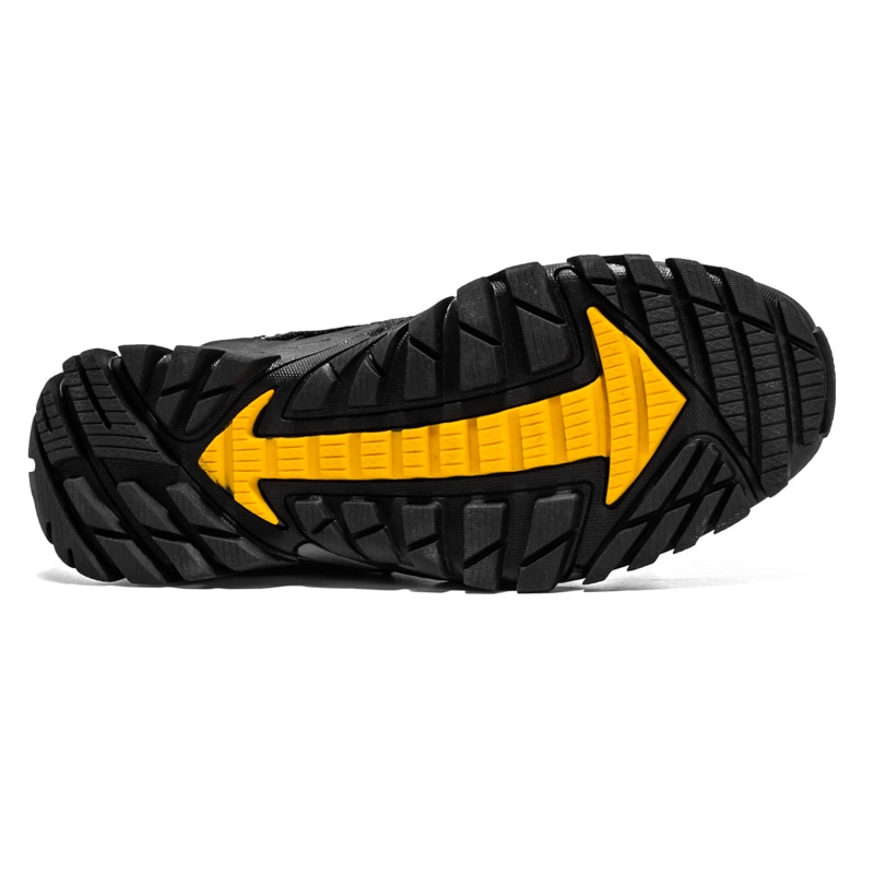 Close-up of the rubber outsole of SF0820 trekking sneakers, featuring a yellow arrow design for enhanced traction and stability.