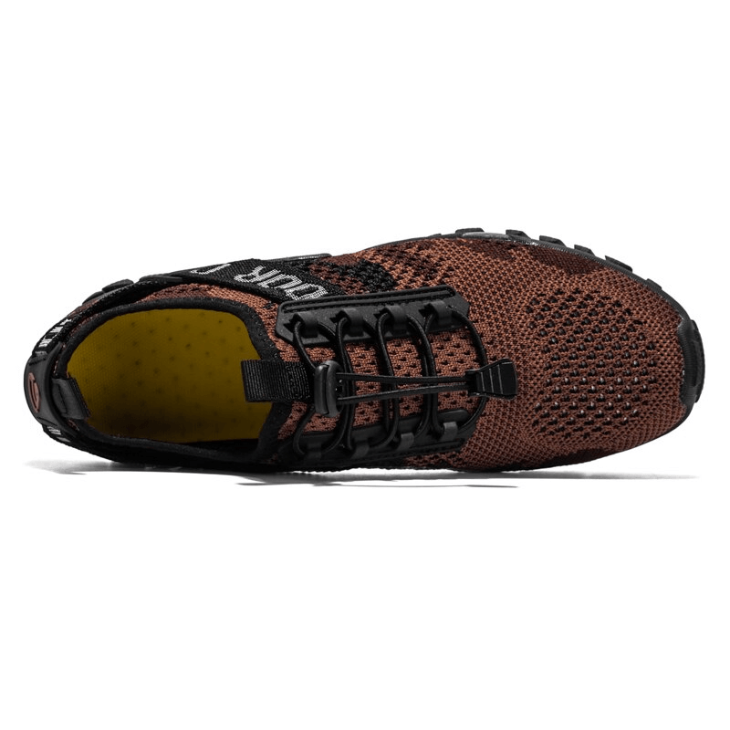 Top view of soft breathable men's trekking sneakers with a non-slip rubber sole and lace-up closure, ideal for hiking or sports.