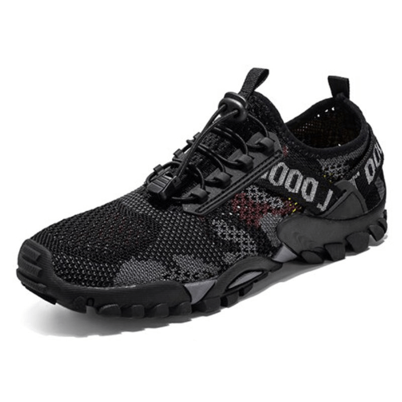 Black soft breathable trekking sneaker for men with non-slip rubber sole and lace-up closure, perfect for outdoor adventures.