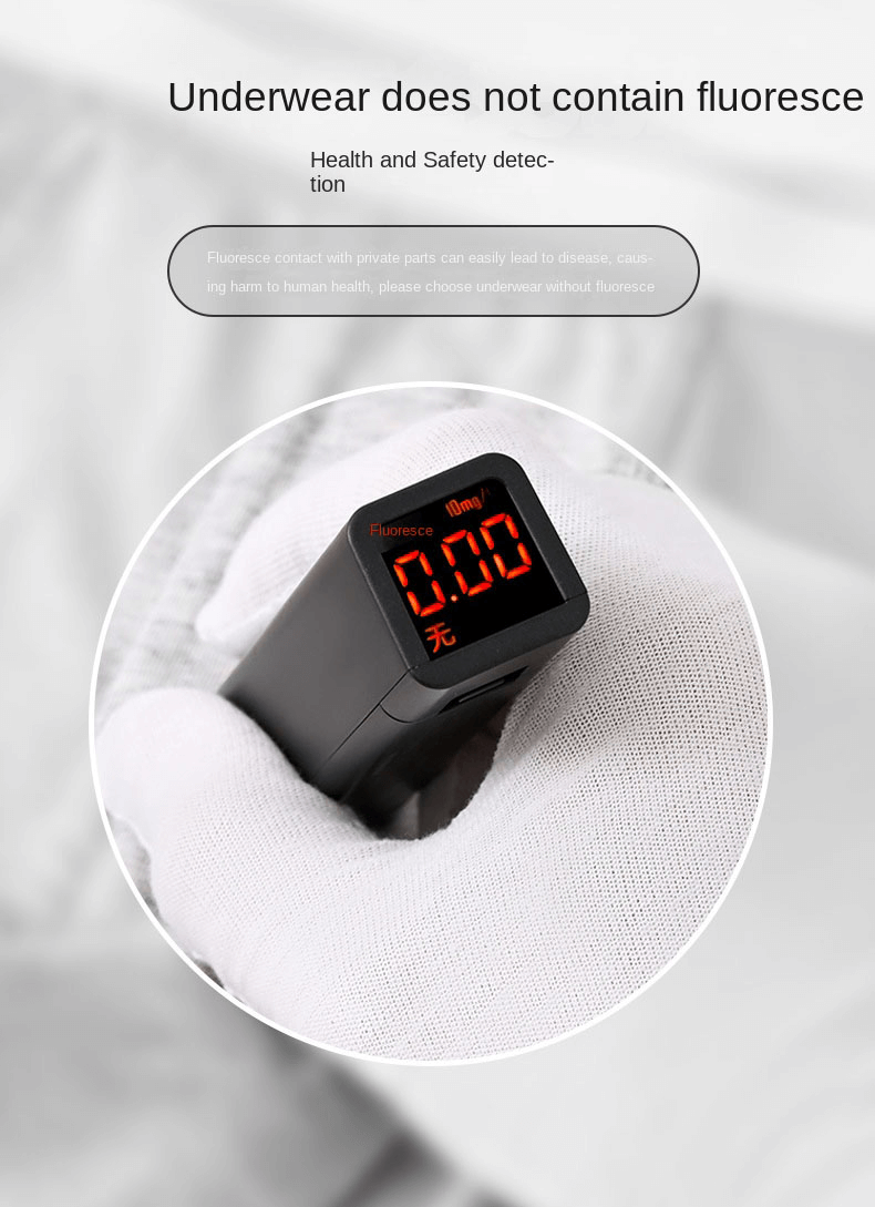 Close-up of a safety meter showing underwear does not contain fluorescence, ensuring health and safety detection.