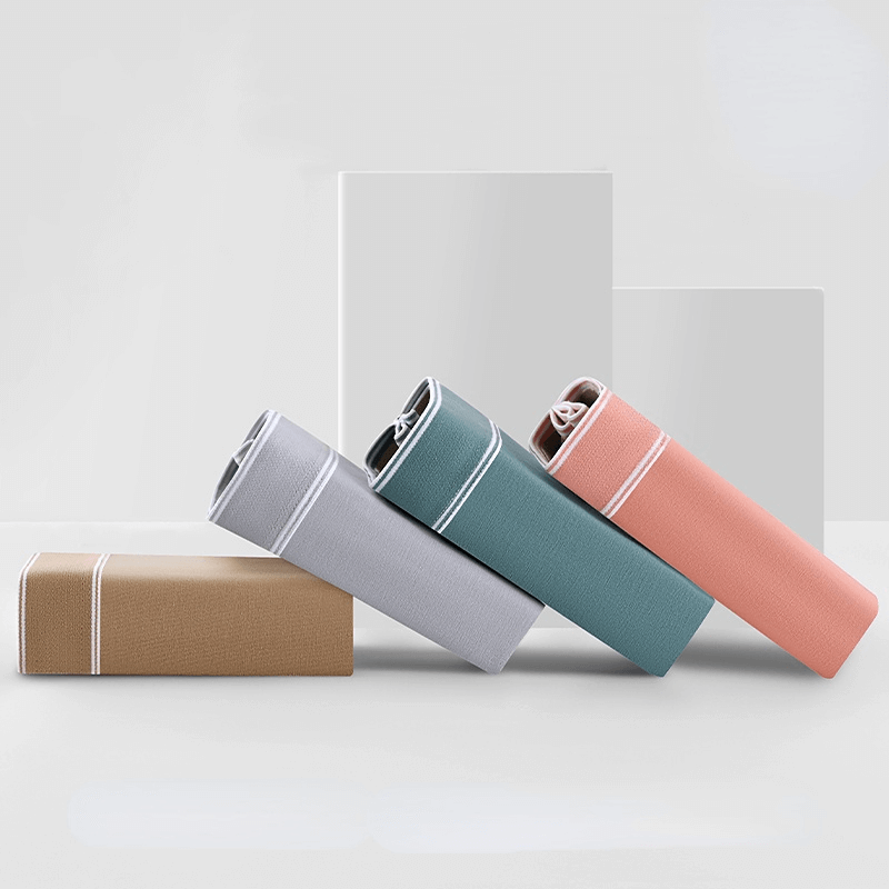 Stack of folded soft cozy cotton boxers for men in assorted colors; breathable fashion underpants SF1241 on display.