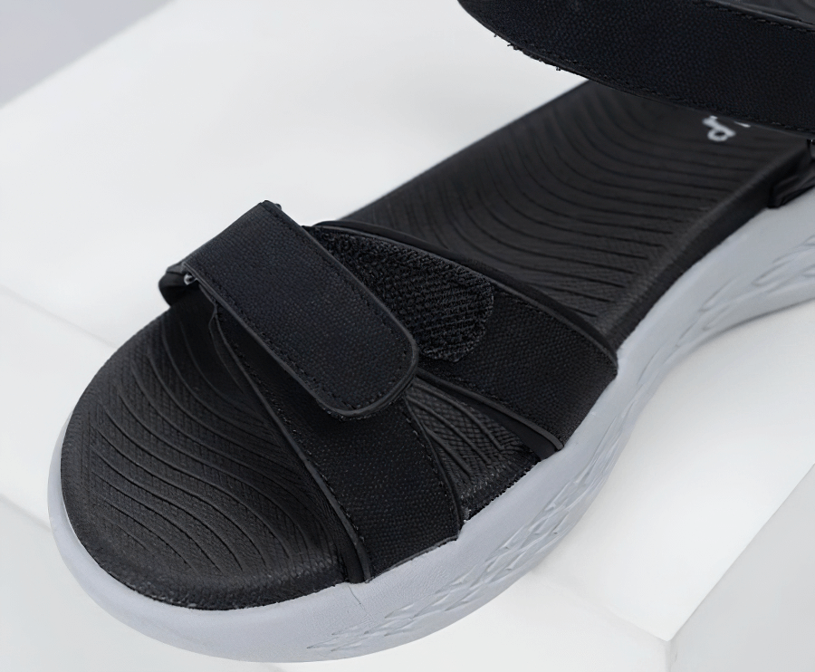 Black soft sole wedge open sandal for women with hook & loop closure, breathable mesh upper, and durable rubber outsole for active lifestyle.