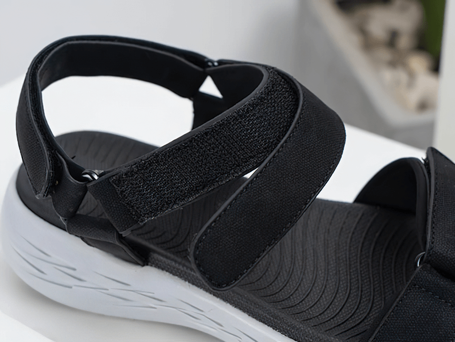 Black soft sole wedge open sandals for women with hook & loop closure, breathable mesh upper, and durable rubber outsole.