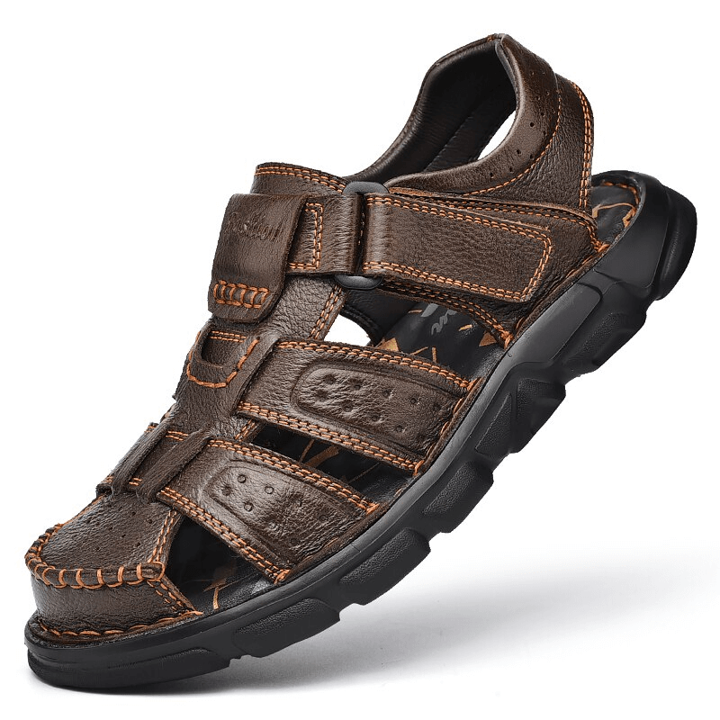 Men's soft soles genuine leather trekking sandals with anti-collision toes, adjustable fit, and rubber outsole for superior grip.