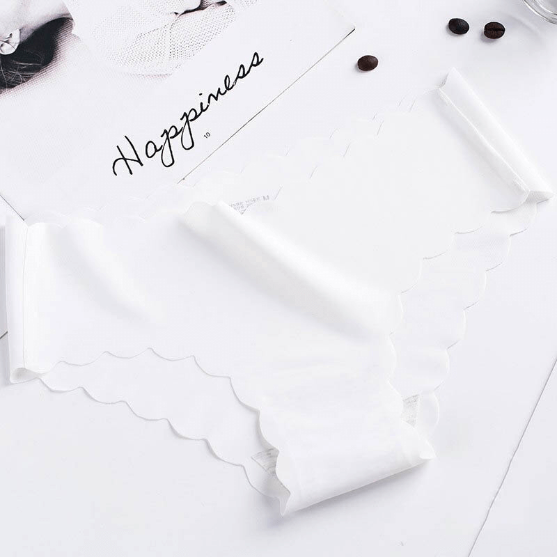 Solid color low waist ruffle stretch seamless briefs in white, showcasing a feminine design with delicate silk and cotton blend.