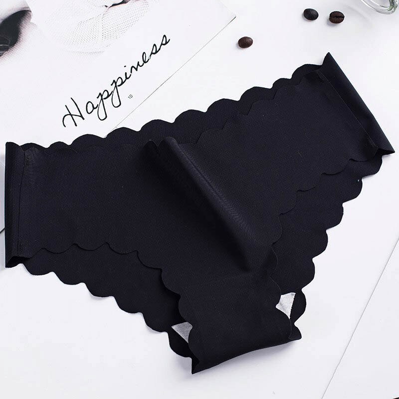 Black low-rise seamless underwear with ruffle design, offering comfort and femininity in cotton-silk blend.