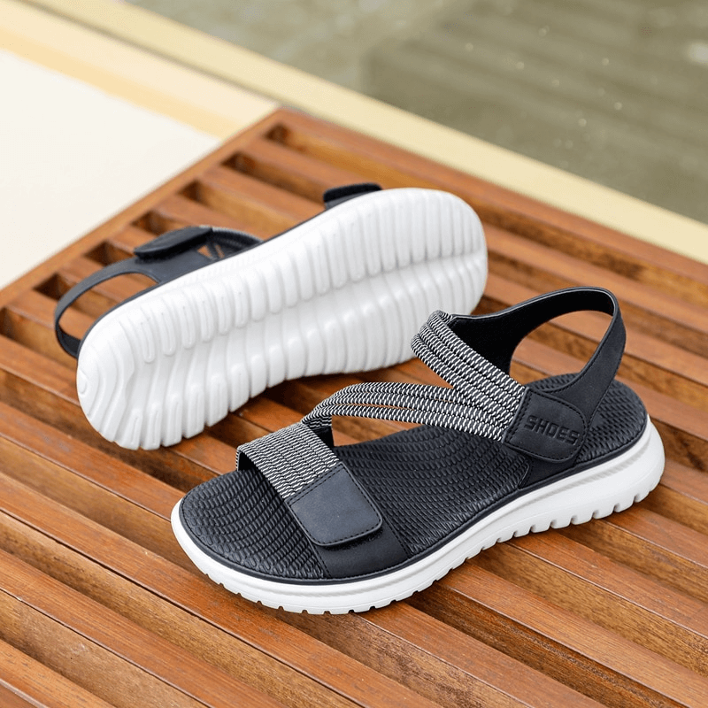 Sport Women's Soft Sandals with Velcro on a wooden surface, showcasing stylish PU leather upper and TPR outsole - Perfect for comfort.