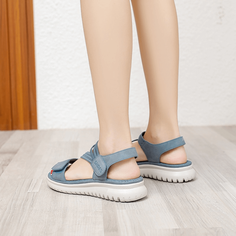 Back view of blue sport women's soft sandals with velcro and flat heel, perfect for comfort and style in summer activities.