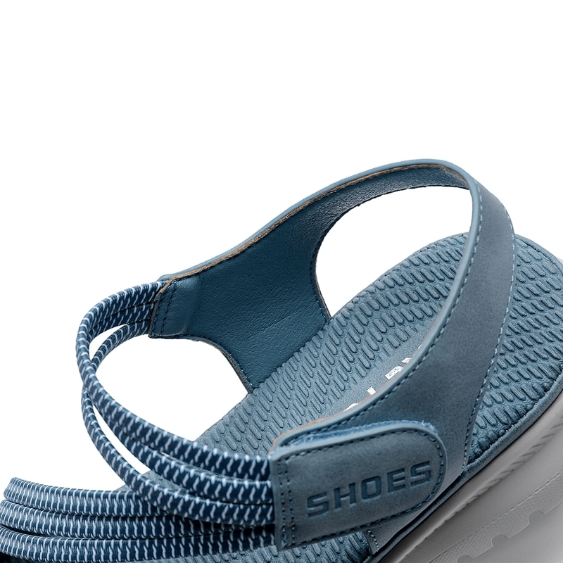 Blue sporty women's sandal with Velcro strap, textured footbed, and PU leather upper, perfect for comfort and style.