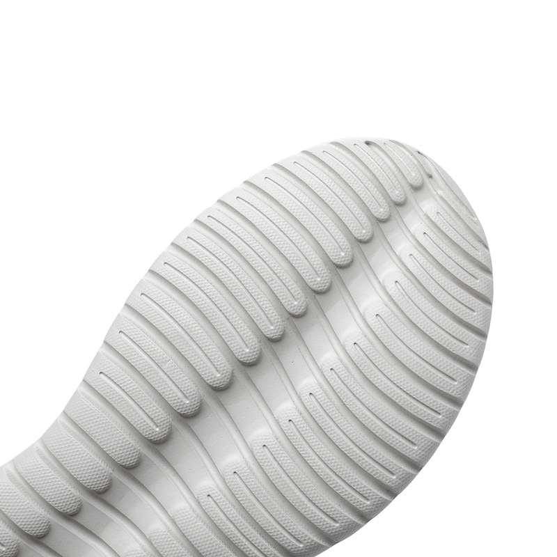 Close-up of white textured TPR outsole of sport women's sandal, highlighting grip and durability.