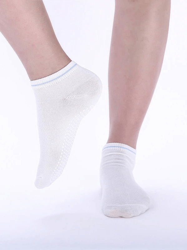White sports anti-slip breathable women's socks with massage granules for extra comfort, perfect for any activity.