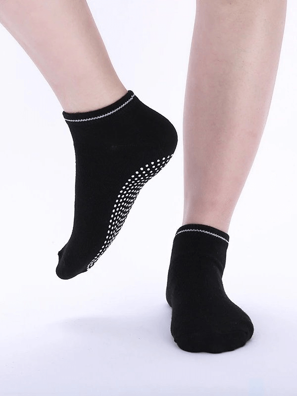 Black sports anti-slip breathable women's socks with massage granules for comfort and non-slip protection, made from high-quality cotton.
