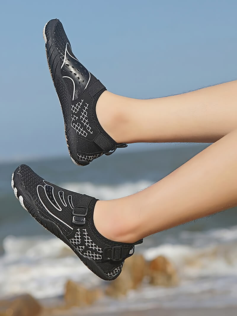 Unisex aqua sports shoes SF0474 for swimming and hiking, featuring a synthetic upper and TPR sole, showcased against a beach background.