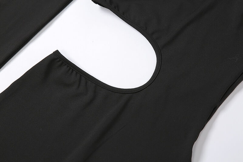 Close-up of black asymmetrical sports elastic high-waist romper fabric, ideal for activewear and casual style.