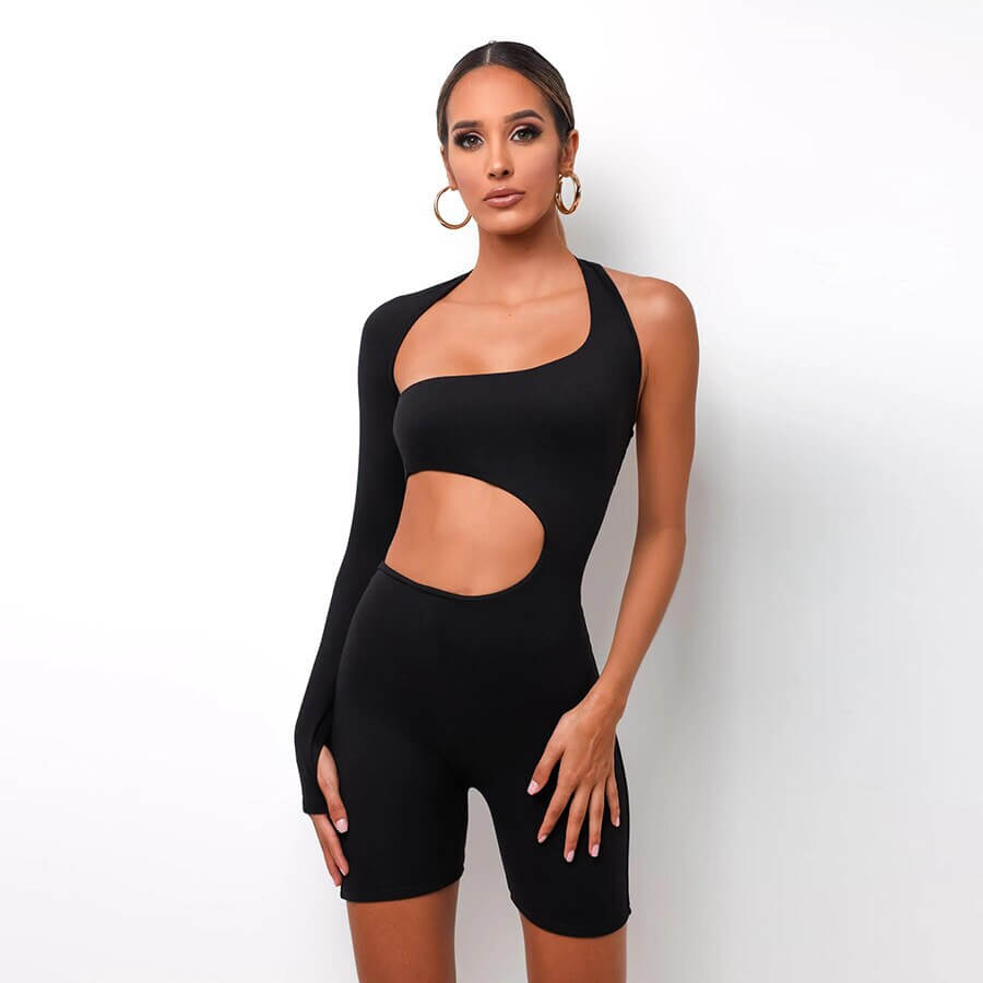 Woman wearing black sports asymmetrical high waist romper, perfect for streetwear, featuring a stylish design with cutout detail. SF1032
