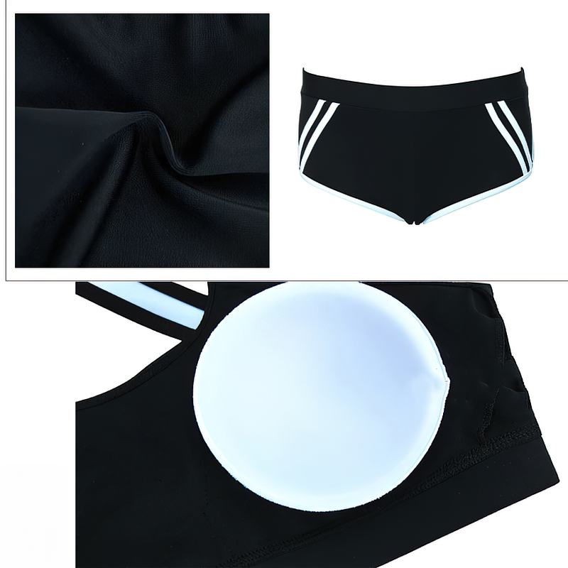 Close-up of black two-piece sports swimsuit with white accents, featuring trunk shorts and string bra - SF0680 design.