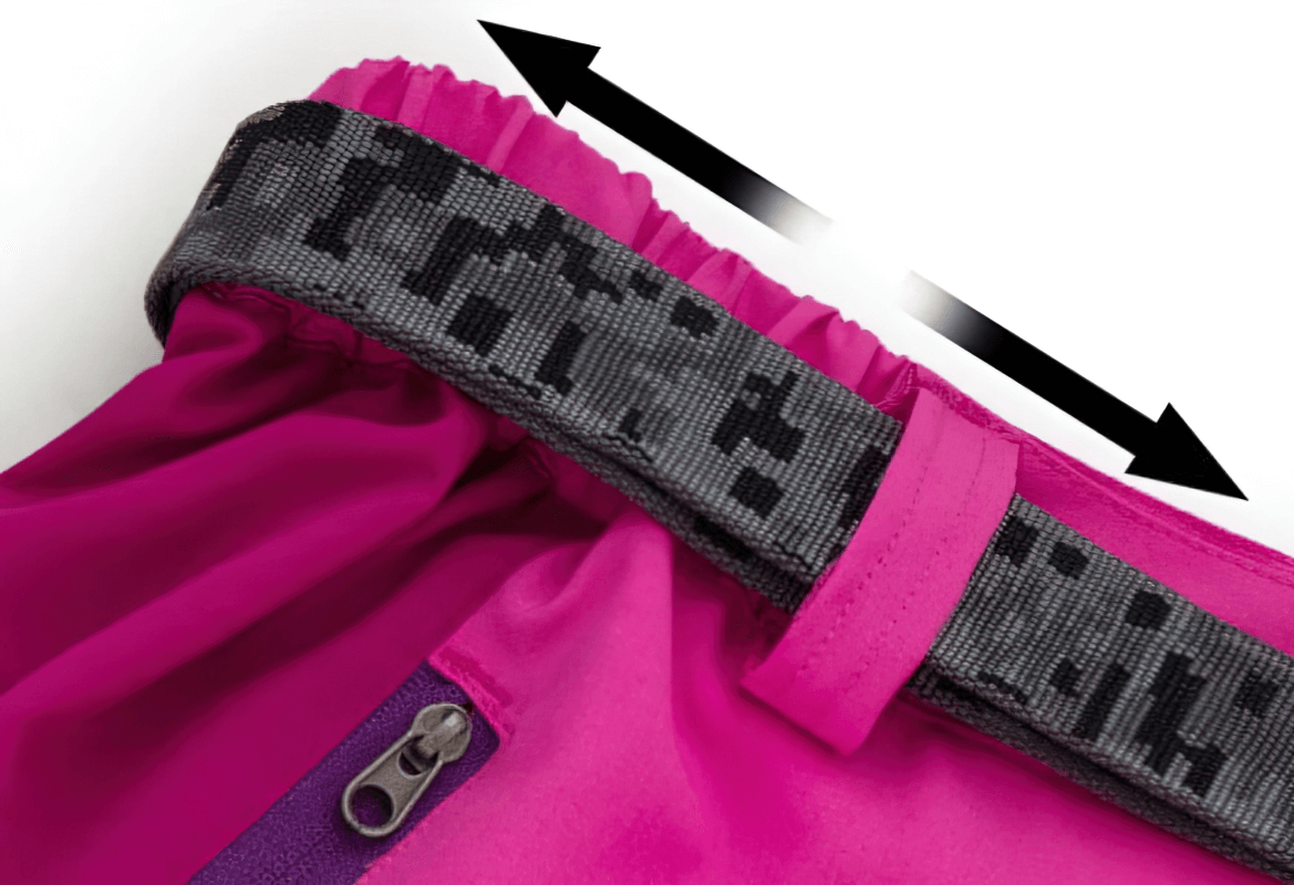 Close-up of adjustable waistband and zipper fly on pink women's quick-drying hiking pants, featuring camo design and breathable fabric.