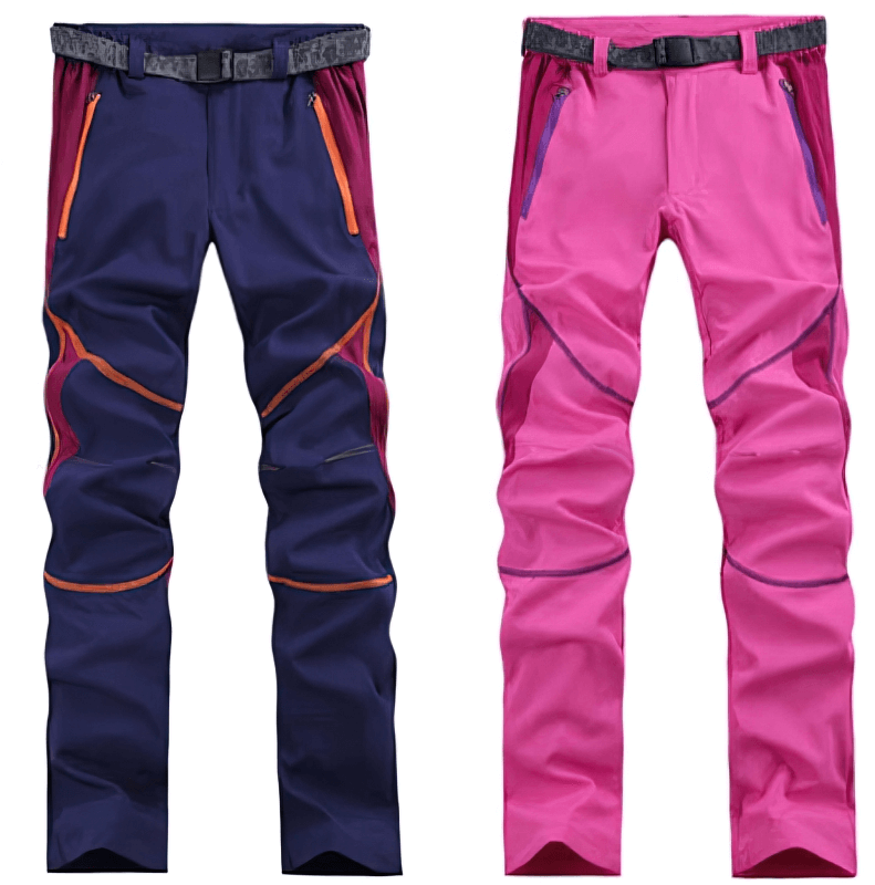 Navy and pink women's hiking pants with breathable, quick-drying fabric, featuring zippered pockets and adjustable belts, ideal for adventure.