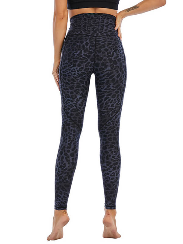 Woman wearing high-waist camouflage sports leggings for yoga, showcasing the breathable nylon-spandex blend fabric in a rear view