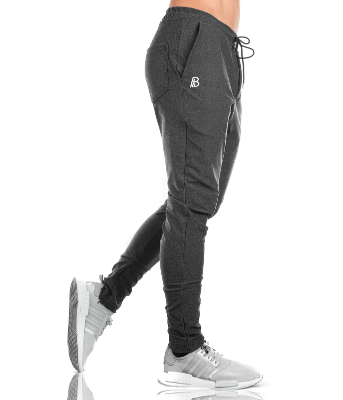 Sports Elastic Quick-Drying Men's Pants with Pockets, ideal for active workouts, featuring lightweight cotton with drawstring closure.