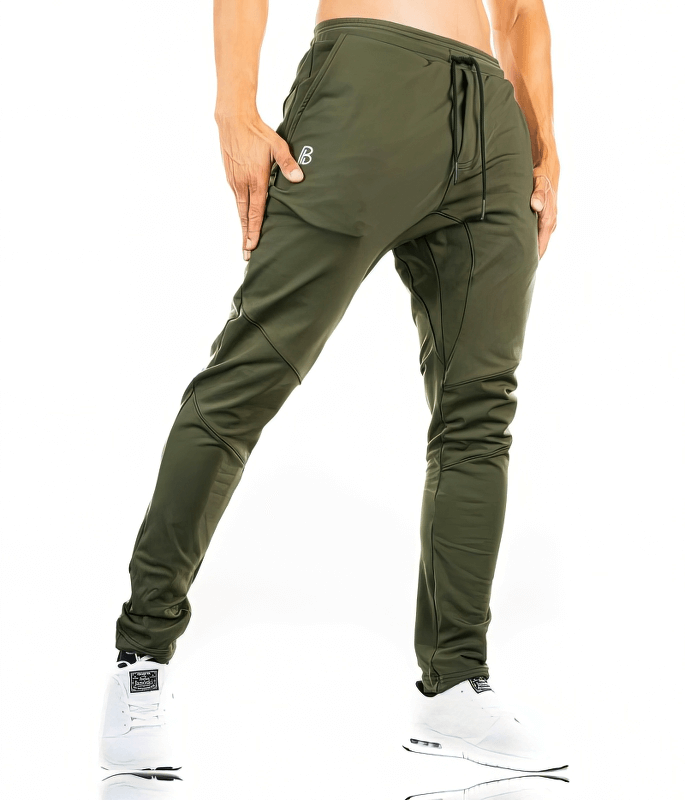 Green Sports Elastic Quick-Drying Men's Pants with Pockets SF1117, designed for optimal mobility and airflow in workouts.