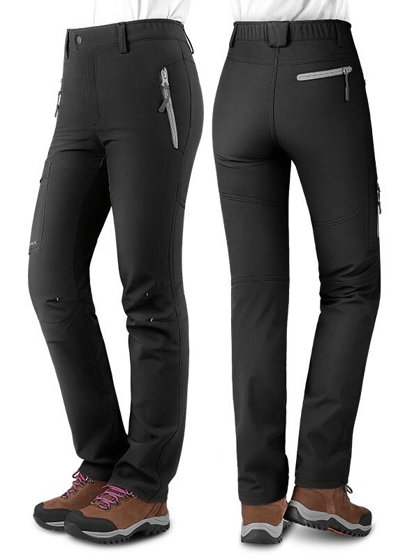 Black windproof women's hiking pants with elastic fit and zippered pockets ideal for outdoor adventures.